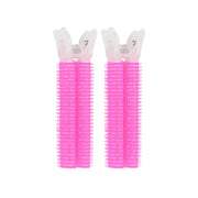 Two pink Clip Hair Roller with white bristle heads on a white background