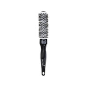 Black hairbrush with round bristle head on a white background